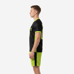 Custom black and neon green soccer uniform right side view displaying contrast neon green cuff trim and back number on black jersey