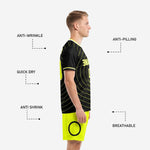 Neon yellow custom soccer shorts with black circle leg graphic and elastic waistband shown as part of black and yellow kit