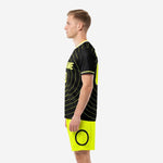 Custom black and yellow soccer uniform right side view showing back name and number placement on black sublimated jersey