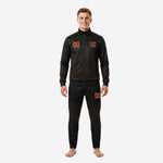 Men's custom black and orange soccer tracksuit front view showing full-zip jacket and tapered pants with chevron print and orange team logo placement