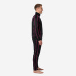 Custom black and pink soccer tracksuit left side view showing hot pink raglan seam piping on jacket and outer leg stripe on tapered pants