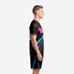 Custom black and pink soccer uniform left side view showing turquoise and purple ray-burst stripes on jet black jersey and shorts