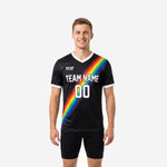 Custom black soccer training jersey with rainbow diagonal stripe and white V-neck collar, front view on male model
