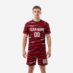 Custom black and red tiger camo soccer uniforms front view on male model showing team name and number on chest