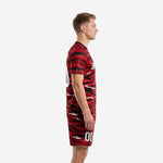 Custom black and red soccer uniforms left side view showing full tiger camo print on jersey and matching shorts