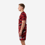 Custom black and red soccer uniforms right side profile view displaying edge to edge tiger camo sublimation print