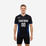 Custom black and white training jersey with Royal Blue lightning-bolt side panels and white team name print, front view on male model