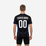 Close-up of Royal Blue lightning-bolt panel graphic on custom black soccer training jersey, showing full-dye sublimation print quality