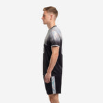 Custom black soccer uniform set with silver iridescent side panel stripe on shorts, alternate side view