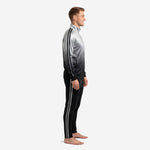 Custom black and silver soccer tracksuit side view showing silver stripe trim on sleeve and pant leg