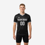 Custom black and silver soccer training jersey front view on male model with team name and number printed on chest