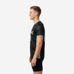 Custom soccer training jersey in jet black and silver grey with V-neck collar and cuff trim shown from right side