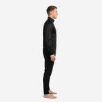 Custom black soccer tracksuit side profile view showing raglan sleeve construction, stand collar full-zip jacket, and tapered pants in jet black sublimation print