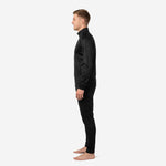 Mens custom black soccer tracksuit right side view displaying geometric diamond-check pattern across jacket body and sleeves with matching black tapered track pants