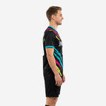 Custom black soccer training jersey left side view showing full-dye sublimation slash pattern and turquoise cuff trim