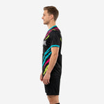 Custom black soccer training jersey right side view with team name and number printed on jet black sublimated fabric