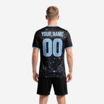 Detail view of custom black soccer uniform jersey showing powder blue constellation pattern and crew neck trim