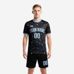 Custom black soccer uniforms with powder blue constellation print, crew neck jersey and matching shorts, front view on male model