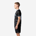 Custom black soccer uniforms constellation kit shown from right side, full sublimation print covering jersey and shorts