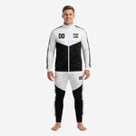 Full set flat lay of custom black and white soccer tracksuit jacket and matching tapered pants with Athletic Gold trim and three-stripe detailing