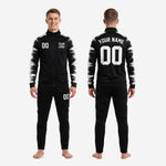 Custom black and white soccer tracksuit sleeve panel closeup showing full-dye sublimation brushstroke design