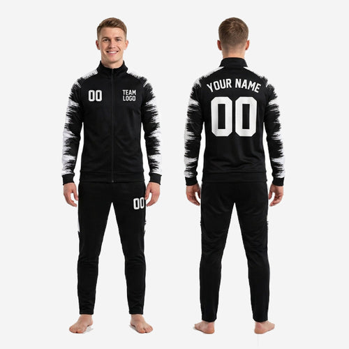 Custom black and white soccer tracksuit sleeve panel closeup showing full-dye sublimation brushstroke design