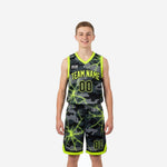 Custom black youth basketball uniforms in dark grey camo and neon yellow-green crack pattern, front and back view of full 2-piece set