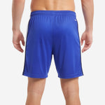 Blue and white soccer shorts side detail showing flat-lock stitching at Navy stripe and White panel junction