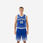Custom blue basketball uniforms in royal blue and white with burst halftone pattern, team name arced on chest and front number, full set front and back