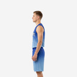 Side view of custom blue basketball uniforms showing the crew neckline, bound armholes, and gradient fade down the shorts leg