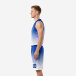 Opposite side view of royal blue and white custom basketball uniforms highlighting the V-neck jersey and gradient shorts construction