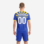 Close detail of sublimated royal blue soccer jersey with gold sunburst rays and custom team name placement