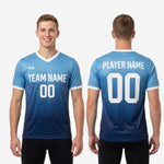 Close-up of white sleeve cuff trim detail on custom blue and navy gradient soccer training jersey