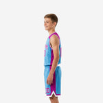 Left side view of sky-blue sublimated youth basketball jersey with purple shoulder insert and matching shorts for youth teams
