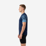 Mens blue soccer training jersey right side view displaying geometric Sky Blue sleeve sublimation pattern against solid Navy Blue torso