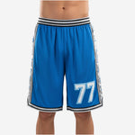 Custom blue and white basketball shorts with royal blue body, silver lightning bolt side panels, and sublimated number 77 on the front thigh