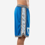 Side view of custom blue and white basketball shorts showing full-length silver zigzag panel and pointed V hem split with black and white stripe trim
