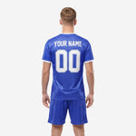 Custom blue and white soccer uniforms rear view displaying YOUR NAME and number 00 in white sublimated print on Royal Blue jersey