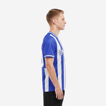 Side view of custom blue and white soccer jersey showing vertical stripe pattern from shoulder to curved hem