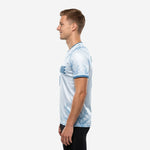 Custom blue and white training jersey right side view displaying Steel Blue contrast cuff trim and ice blue polyester body