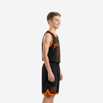 Youth boy wearing custom boys basketball uniforms in black with orange V-neck binding arched team name and front number 00