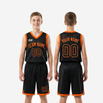 Size and specification sheet for custom boys basketball uniforms in black and orange youth size run