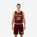 Custom burgundy basketball uniforms with gold geometric side panels, arced team name and front number on a men's full set front and back