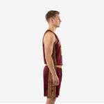 Front view of burgundy and gold sublimated basketball uniform set with scoop neckline and geometric aztec trim binding