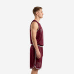 Front view of custom burgundy basketball uniform set with silver arced team name across chest and large front number on deep burgundy jersey