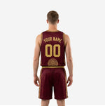 Opposite side view of burgundy and gold basketball uniform set showing matching geometric panel on jersey and shorts leg