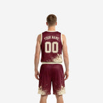 Right side view of fully sublimated burgundy basketball uniform showing splash graphic wrapping around the jersey hem and shorts leg