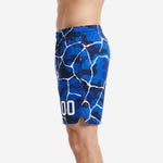 Second side view of custom royal blue and white camo basketball shorts showing continuous all-over sublimated crackle print across leg panel
