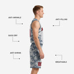 Detail view of grey digital camo basketball shorts showing elastic waistband, drawcord, hem binding, and red sublimated player number
