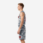 Opposite side view of grey and white digital camo basketball uniform showing full camo side panel on jersey and shorts hem binding